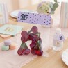 Diseño de bolsita de chuches con estética Coquette en tonos pastel suaves.