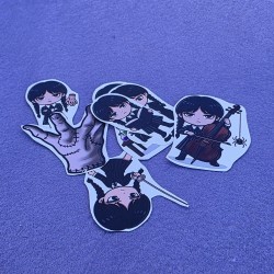 Diseño de set de pegatinas con temática inspirada en la familia Addams.